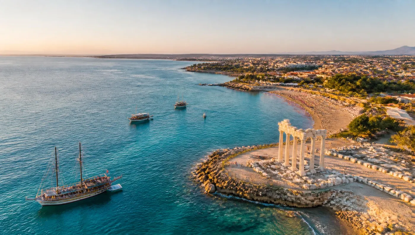 Aerial view of Side, Antalya with the ancient temple, excursion boats and the turquoise Mediterranean sea